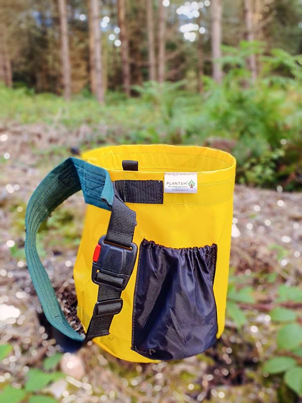 PLANTEM Single Tree Planting Bag in woodland next to tree saplings