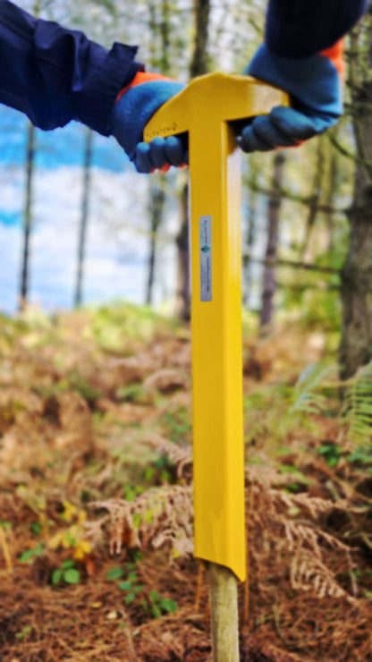 StakeAid used by a person in woodland to drive a steak into the ground